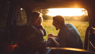 Man proposing his girlfriend in the car